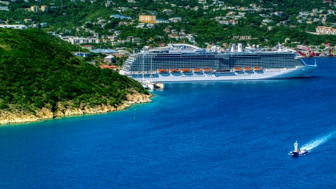 AX102_200.0000000F - Aerial stock photo of Cruise ship docked at the coastal island town of Charlotte Amalie, St. Thomas 