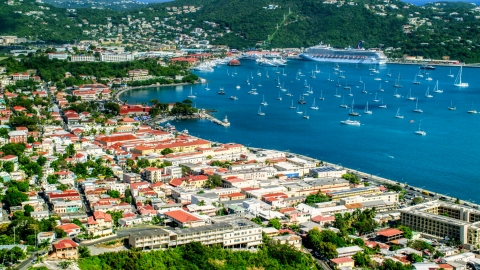 Sailboats in the harbor beside the Caribbean island town of Charlotte Amalie, St Thomas  Aerial Stock Photos | AX102_220.0000000F