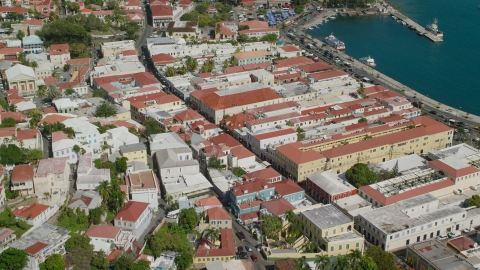 AX102_223.0000000F - Aerial stock photo of Island town buildings by the harbor in Charlotte Amalie, St Thomas, the US Virgin Islands