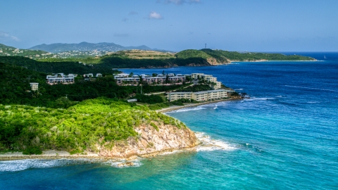 AX102_236.0000000F - Aerial stock photo of Oceanfront condominiums overlooking sapphire blue waters, Southside, St Thomas 