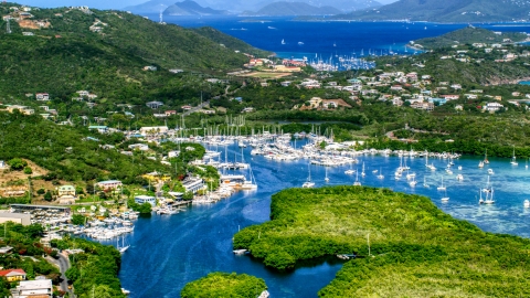 AX102_238.0000000F - Aerial stock photo of Boats docked at a marina in Benner Bay, St Thomas, US Virgin Islands 