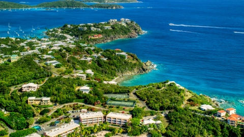 Upscale oceanfront homes beside sapphire blue waters, East End, St Thomas  Aerial Stock Photos | AX102_246.0000000F