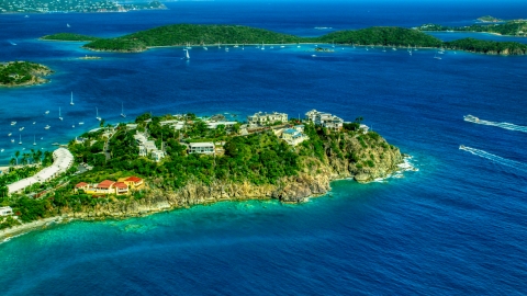 AX102_247.0000000F - Aerial stock photo of Hillside oceanfront homes overlooking sapphire blue waters, East End, St Thomas 