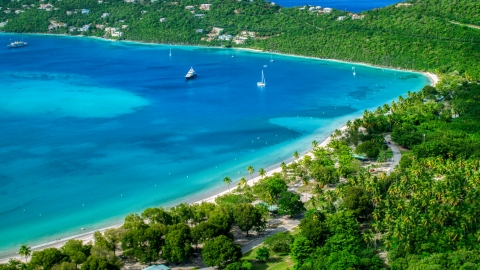 AX102_272.0000000F - Aerial stock photo of White sand Caribbean beach and turquoise blue waters with sailboats, Magens Bay, St Thomas