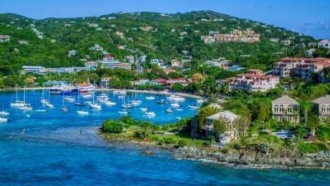 AX103_030.0000000F - Aerial stock photo of Turquoise blue Caribbean waters in the harbor with boats, Cruz Bay, St John