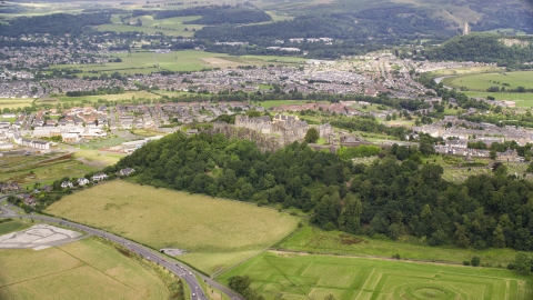 Hilltop Stirling Castle by residential neighborhoods, Stirling, Scotland Aerial Stock Photos | AX109_016.0000000F