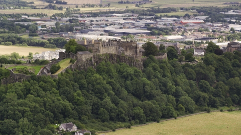 A view of historic Stirling Castle on a hill in Scotland Aerial Stock Photos | AX109_021.0000170F