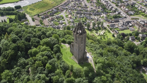 AX109_051.0000142F - Aerial stock photo of The historic Wallace Monument with a view of Stirling, Scotland