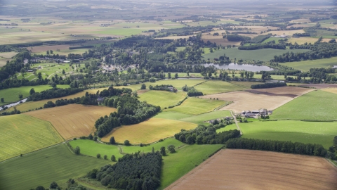 AX109_063.0000000F - Aerial stock photo of A farm and farmland in Blair Drummond, Scotland