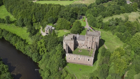 A view of historic Doune Castle and its grounds, Scotland Aerial Stock Photos | AX109_072.0000000F