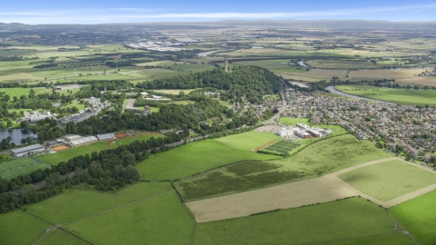 The Wallace Monument in the middle of a residential area, Scotland Aerial Stock Photos | AX109_097.0000000F