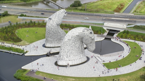 Profile view of The Kelpies sculptures in Falkirk, Scotland Aerial Stock Photos | AX109_127.0000201F