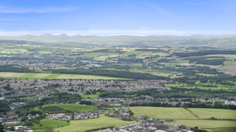 AX109_166.0000053F - Aerial stock photo of Farmland and a Scottish village, Bonnybridge, Scotland