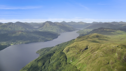 AX110_058.0000000F - Aerial stock photo of Loch Lomond and green mountains in the Scottish Highlands, Scotland