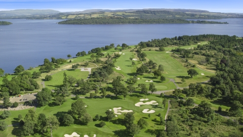 AX110_116.0000000F - Aerial stock photo of Loch Lomond Golf Course beside the water, Luss, Scottish Highlands, Scotland