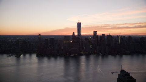 AX118_024.0000127F - Aerial stock photo of World Trade Center skyline at sunrise in Lower Manhattan, New York City