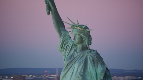 Profile of the Statue of Liberty at sunrise, New York Aerial Stock Photos | AX118_060.0000000F