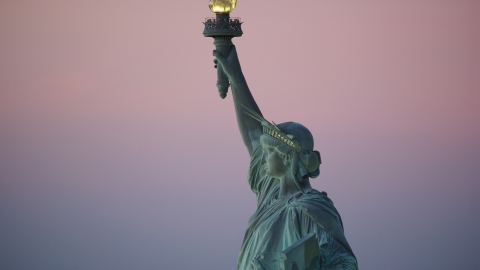 The Statue of Liberty's profile at sunrise, New York Aerial Stock Photos | AX118_060.0000227F