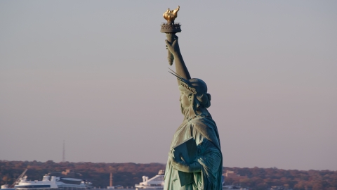 Left side profile of the Statue of Liberty at sunrise in New York Aerial Stock Photos | AX118_114.0000066F