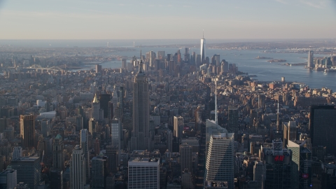 Empire State Building and Downtown skyscrapers at sunrise in New York City Aerial Stock Photos | AX118_200.0000105F