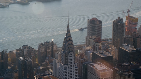 AX118_202.0000118F - Aerial stock photo of The Chrysler Building at sunrise in New York City