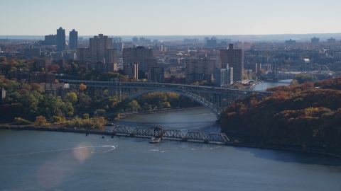 AX119_055.0000161F - Aerial stock photo of The Henry Hudson and Spuyten Duyvil Bridges in Autumn in The Bronx, New York City