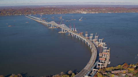 AX119_087.0000128F - Aerial stock photo of Tappan Zee Bridge spanning the Hudson River in Autumn, Tarrytown, New York