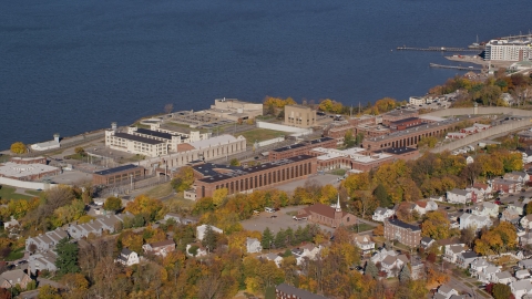 AX119_113.0000141F - Aerial stock photo of Sing Sing Prison in Autumn, Ossining, New York