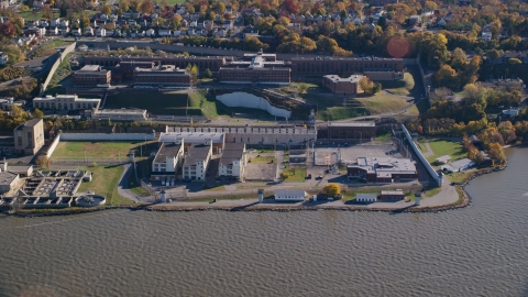 AX119_121.0000225F - Aerial stock photo of The Sing Sing Prison facility in Autumn, Ossining, New York