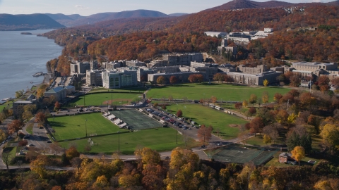 AX119_169.0000095F - Aerial stock photo of Grounds of the United States Military Academy at West Point in Autumn in New York