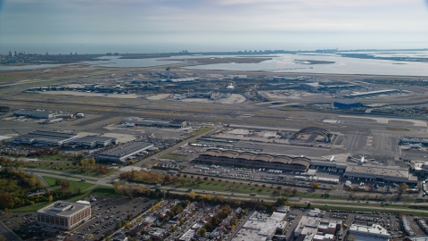 AX120_050.0000049F - Aerial stock photo of John F. Kennedy International Airport in Autumn, Queens, New York City