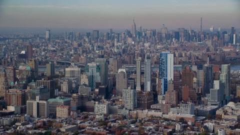 AX120_087.0000088F - Aerial stock photo of Downtown Brooklyn skyscrapers in Autumn, Midtown in the background, New York City