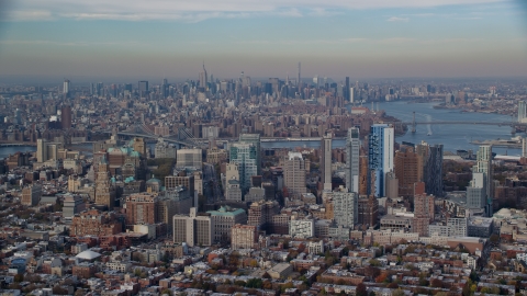 AX120_088.0000069F - Aerial stock photo of Downtown Brooklyn in autumn with Midtown in the background, New York City