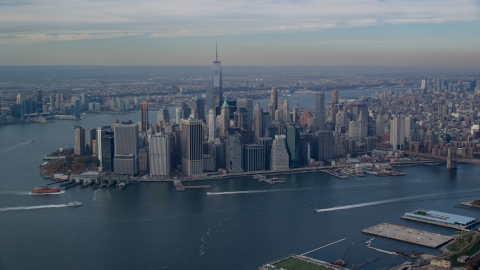 A view of Lower Manhattan skyscrapers across the East River in Autumn, New York City Aerial Stock Photos | AX120_090.0000272F