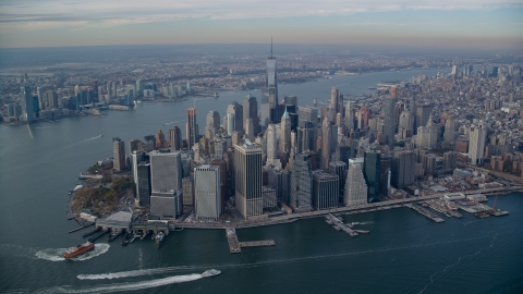 AX120_092.0000183F - Aerial stock photo of Lower Manhattan skyscrapers and rivers in Autumn, New York City