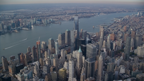 AX120_096.0000117F - Aerial stock photo of World Trade Center and Lower Manhattan skyscrapers by the Hudson River, New York City