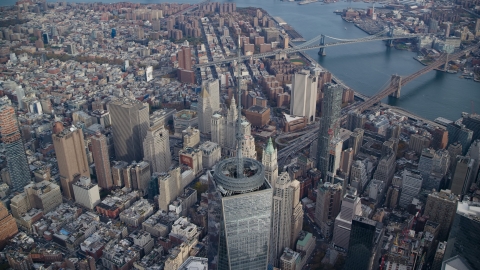 AX120_103.0000178F - Aerial stock photo of Top of Freedom Tower and East River bridges in Lower Manhattan, New York City