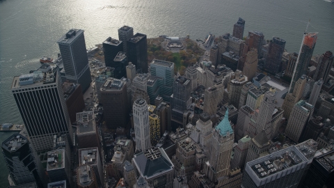 AX120_107.0000254F - Aerial stock photo of Skyscrapers and Battery Park's Castle Clinton in Lower Manhattan, New York City