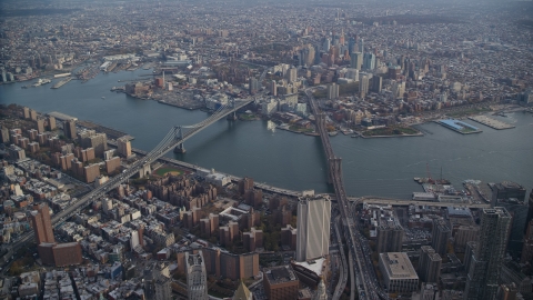 AX120_113.0000091F - Aerial stock photo of Brooklyn Bridge and Manhattan Bridge spanning the East River in New York City