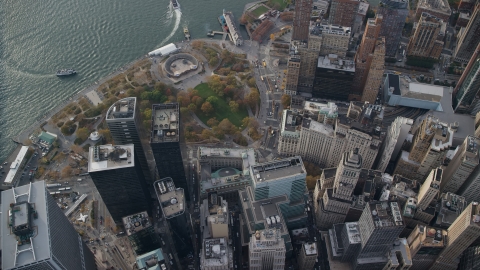 AX120_118.0000185F - Aerial stock photo of Bird's eye view of skyscrapers and Battery Park in Lower Manhattan, New York City