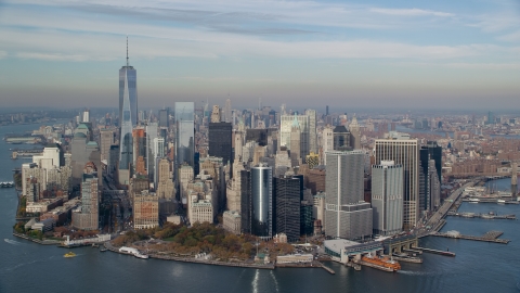 AX120_122.0000245F - Aerial stock photo of Lower Manhattan and Battery Park in Autumn, New York City