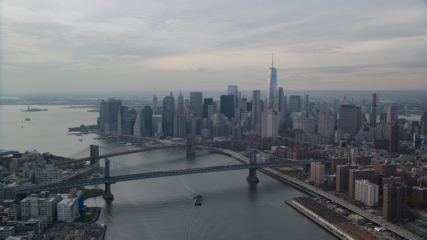 AX120_142.0000057F - Aerial stock photo of Lower Manhattan S=skyscrapers by the Brooklyn and Manhattan Bridges, New York City