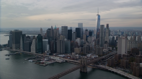 AX120_145.0000170F - Aerial stock photo of Part of the Brooklyn Bridge and Lower Manhattan skyscrapers, New York City