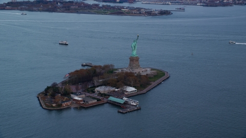 The Statue of Liberty at sunset In Autumn, New York Aerial Stock Photos | AX121_013.0000082F