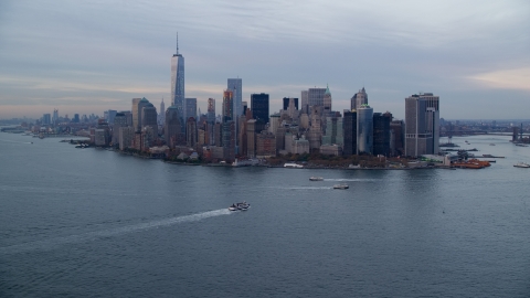 AX121_017.0000111F - Aerial stock photo of Battery Park and the Lower Manhattan skyline at Sunset, New York City