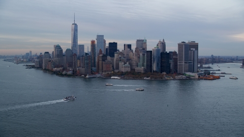 Battery Park and Lower Manhattan skyscrapers at sunset, New York City Aerial Stock Photos | AX121_017.0000261F