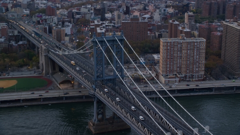 AX121_025.0000063F - Aerial stock photo of The Manhattan Bridge at sunset in New York City