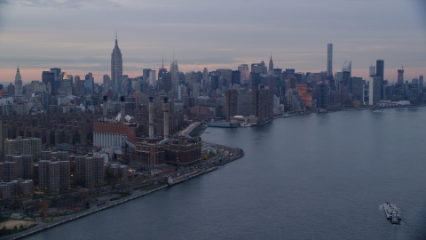 East Village power plant and Midtown skyscrapers at sunset in New York City Aerial Stock Photos | AX121_046.0000078F