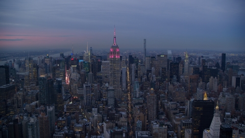 AX121_082.0000155F - Aerial stock photo of A view of the Empire State Building in Midtown at sunset in New York City