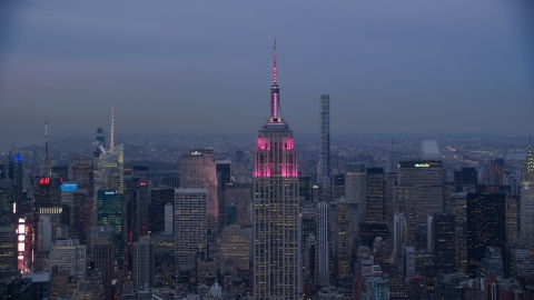 AX121_083.0000005F - Aerial stock photo of Top of Empire State Building at sunset in Midtown Manhattan, New York City